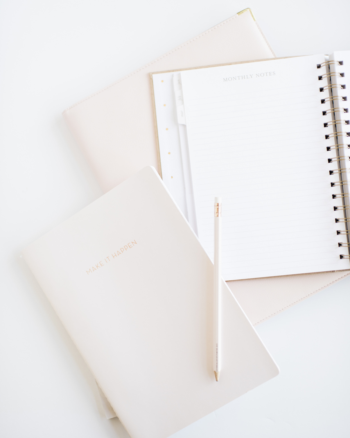 Three Notebook Planners on a White Background